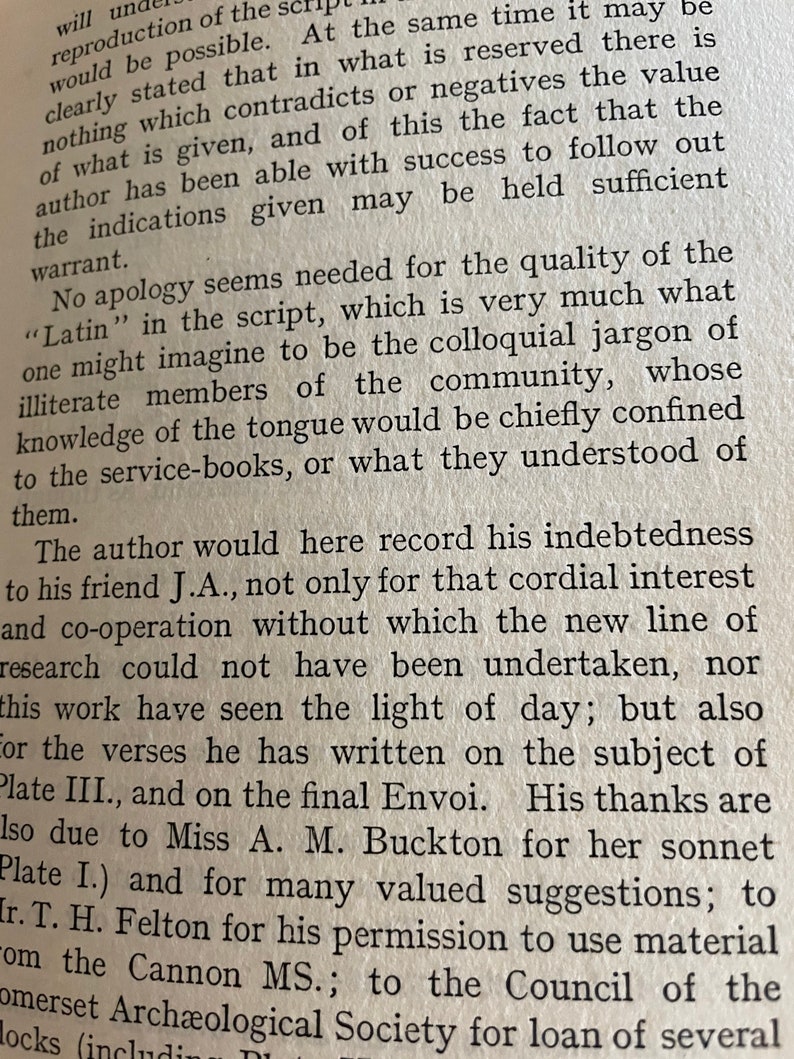 May include: Close-up of a vintage book page with printed text. The text is in black ink on aged, cream-colored paper. The page includes paragraphs and sentences, with some words highlighted. The book appears to be an academic or historical text.