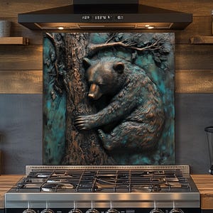 May include: A decorative kitchen backsplash featuring a detailed relief sculpture of a bear hugging a tree. The bear is rendered in shades of brown and teal, creating a rustic and natural aesthetic. The backsplash is installed above a stainless steel gas range.