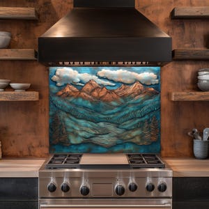 May include: A decorative kitchen backsplash featuring a mountain landscape with blue, teal, and orange hues. The artwork depicts mountains, valleys, and clouds, adding a natural element to the kitchen decor. The backsplash is installed above a stainless steel gas hob.