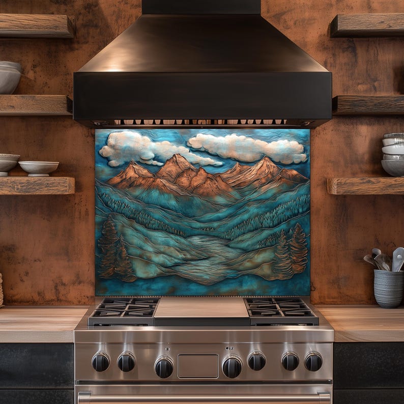 May include: A decorative kitchen backsplash featuring a mountain landscape with blue, teal, and orange hues. The artwork depicts mountains, valleys, and clouds, adding a natural element to the kitchen decor. The backsplash is installed above a stainless steel gas hob.
