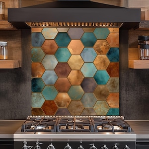 May include: A kitchen backsplash with a pattern of hexagonal tiles in teal, copper, gold, and grey. The tiles have a metallic, textured appearance and are installed behind a black hob and extractor hood.