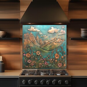 May include: A decorative kitchen backsplash featuring a mountain landscape with flowers and clouds. The artwork has a turquoise and bronze color scheme, with a variety of colorful flowers in the foreground. The backsplash is installed above a black gas stove.