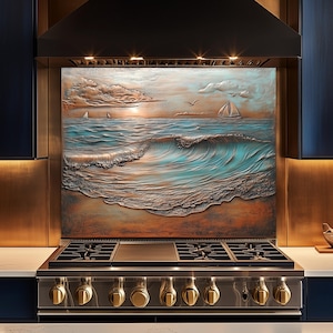 May include: A kitchen splashback depicting a textured ocean scene with waves, sailboats, and birds. The artwork has a blue, brown, and orange colour palette. The splashback is above a stainless steel gas range with gold knobs.