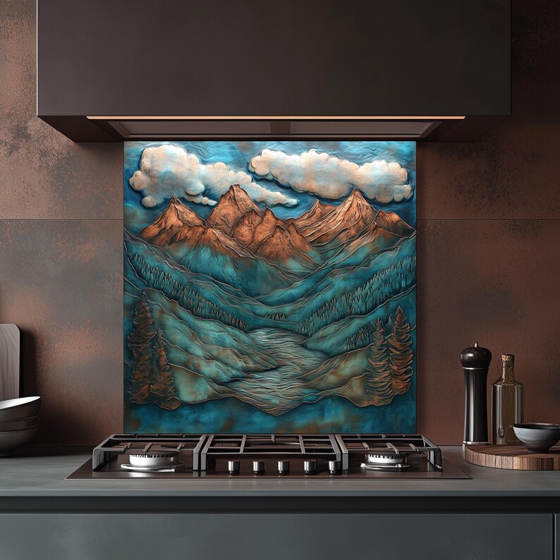 May include: A decorative kitchen splashback depicting a mountain scene with copper-toned peaks, teal valleys, and white clouds against a blue sky. The artwork is mounted above a gas hob.