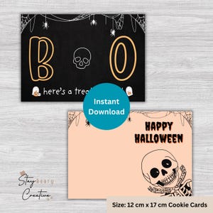 May include: Two Halloween cookie cards. One is black with orange "BO", a skull, and "here's a treat." The other is peach with "HAPPY HALLOWEEN" and a skeleton. Size: 12 cm x 17 cm. Spiderwebs and spiders decorate the cards.