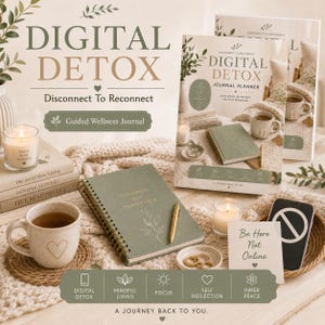 May include: A sage green spiral-bound journal titled Digital Detox Journal Planner with the text Progress Not Perfection. Includes a speckled mug with a heart, a gold pen, a candle, a card reading Be Here Not Online, and a smartphone with a no-symbol.