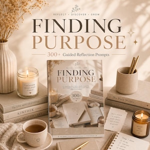 May include: A serene arrangement featuring a journal titled "Finding Purpose" with "300+ Guided Reflection Prompts." The image includes candles, books, a cup of tea, and pens. The journal cover reads: "A journal for soulful discovery, meaningful growth & a life that feels aligned."