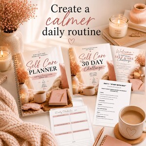 May include: A collection of self-care items, including a planner, a 30-day challenge book, and daily check-in sheets. The items are arranged with candles, a mug, and decorative elements, all in soft, neutral tones. The text "Create a calmer daily routine" is visible.