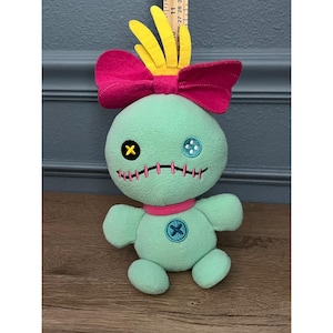 Muñeco de peluche Disney Stitch Scrump con lazo rosa, verde menta y pelo amarillo imagen 1