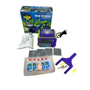 May include: A Bug Creator kit with a purple and green molding oven, bottles of glue, and bug molds. The box features the movie "A Bug's Life" and the words "Bug Creator".
