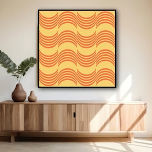 May include: A framed abstract art print featuring a repeating wave pattern in orange and yellow. The artwork is displayed above a wooden cabinet with decorative vases and greenery. The overall aesthetic is modern and minimalist.