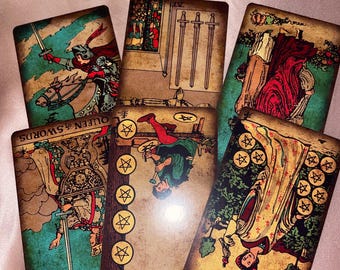 May include: A set of ten tarot cards with vintage-style illustrations. The cards feature a variety of scenes and symbols, including a queen on a horse, swords, and pentacles. The cards are printed on a textured paper with a worn, aged look.