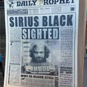 May include: A newspaper page from "The Daily Prophet" with the headline "Sirius Black Sighted." The image features a black and white photo of a man holding a prison sign. The newspaper has a vintage look.