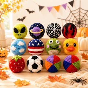 May include: A collection of twelve spherical crochet toys featuring various designs including an alien, a planet, a spiderweb, flames, clouds, a flag, a frog, a duck, a strawberry, a soccer ball, and two multi-colored geometric patterns.
