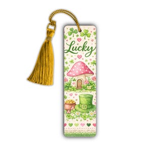 May include: A St. Patrick's Day themed bookmark with a gold tassel. The bookmark features a whimsical design with a pink mushroom house, a green leprechaun hat, and a pot of gold. The word "Lucky" is written in green.