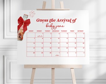 May include: A white easel displays a calendar with the text "Guess the Arrival of baby jane." A red bow adorns a soda bottle illustration. The calendar grid is in red, with dates from September to October.
