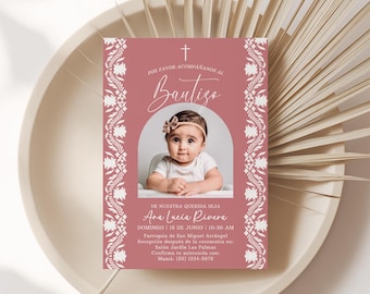 May include: A baptism invitation card with a photo of a baby girl. The card has a pink background with white floral border. The text includes the word "Bautizo" and the baby's name, Ana Lucia Rivera.