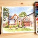 May include: Watercolour painting of a brick house with a brown garage door, a green lawn, and a blue sky. A dog and a cat are playing on the lawn. A paintbrush and a watercolour palette are on the wooden surface.