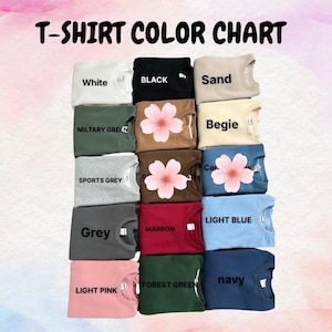Puede incluir: Una carta de colores que muestra varios colores de camisetas. La carta incluye colores como blanco, negro, arena, verde militar, beige, gris deportivo, gris, marr&oacute;n, rosa claro, verde bosque y azul marino. Algunas camisetas tienen un dise&ntilde;o floral.