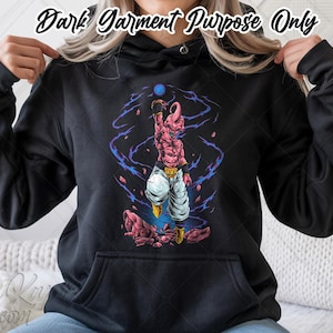 May include: Black hoodie featuring a pink and white cartoon character with a blue orb, surrounded by purple energy. The text "Dark Garment Purpose Only" is at the top. The hoodie has a front pocket and a drawstring hood.