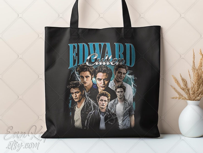 May include: Black tote bag featuring a collage of images of Edward Cullen with the text "EDWARD Cullen" in a blue and silver design. The bag has black handles and a white background.