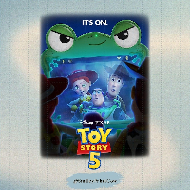 May include: A green tablet-shaped device with a frog face design, displaying the Toy Story 5 movie poster. The poster features Woody, Buzz Lightyear, and Jessie. The text "IT'S ON" is at the top.