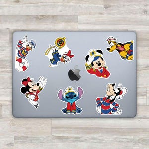 May include: A collection of colorful cartoon stickers featuring Disney characters in nautical attire. Mickey Mouse, Minnie Mouse, Donald Duck, Daisy Duck, Goofy, Pluto, and Stitch are depicted in sailor uniforms and captain hats.