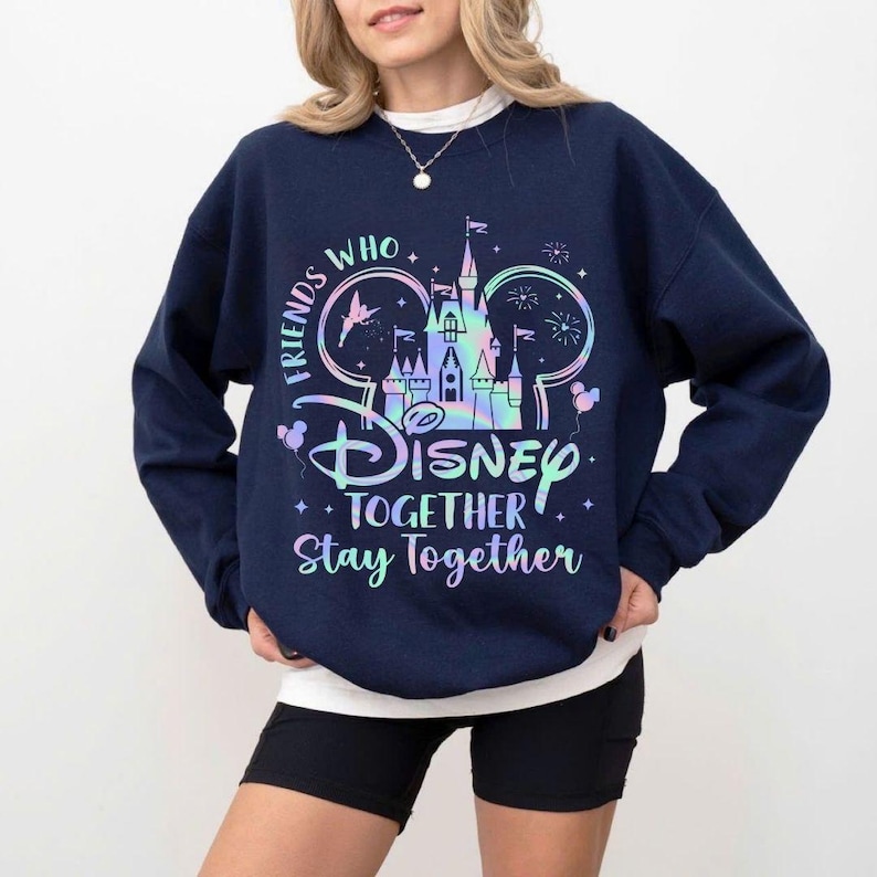 May include: Navy blue sweatshirt with a colorful Disney castle graphic and the text "Friends Who Disney Together Stay Together." The design includes Mickey Mouse ears, stars, and balloons. The sweatshirt is a crew neck style.