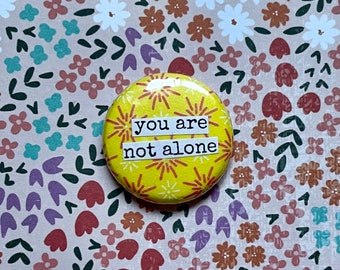 You Are Not Alone - Collage Pinback Button, Magnet, Zipper Pull, Keychain, Mirror, Bottle Opener, or Ornament