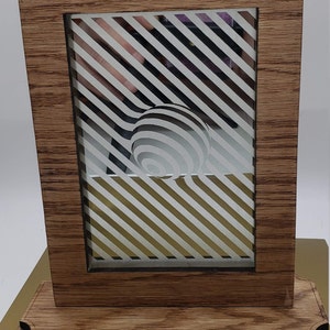Art Laser Engraved on a Mirror. We do custom mirror etching. Reuse, repurpose and recycle old mirrors.