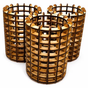 May include: Three cylindrical containers constructed from light-colored wood with a dark, charred finish on the edges. Each container features an open grid pattern formed by vertical and horizontal slats, creating a hollow, cage-like structure.