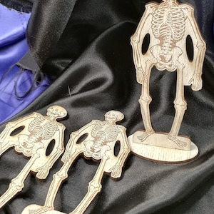 Buy Cheerful table-top wooden skeletons, standing tall on sturdy bases—perfect, budget-friendly Halloween accents. Save with bulk purchases.