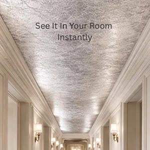 May include: A hallway featuring a textured silver ceiling and white walls. The image includes the text "See It In Your Room Instantly". Wall sconces are positioned along the corridor, providing soft lighting.
