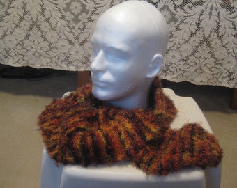 Hand Knitted Orange, Gold, Black, and Brown Variegated Scarf Made With Eyelash Yarn - 56 inches long and 6 inches wide