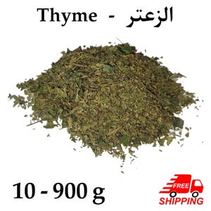 May include: A pile of dried thyme leaves, a culinary herb, is displayed against a white background. The text "Thyme - الزعتر" is at the top. The weight range is indicated as 10 - 900 g.