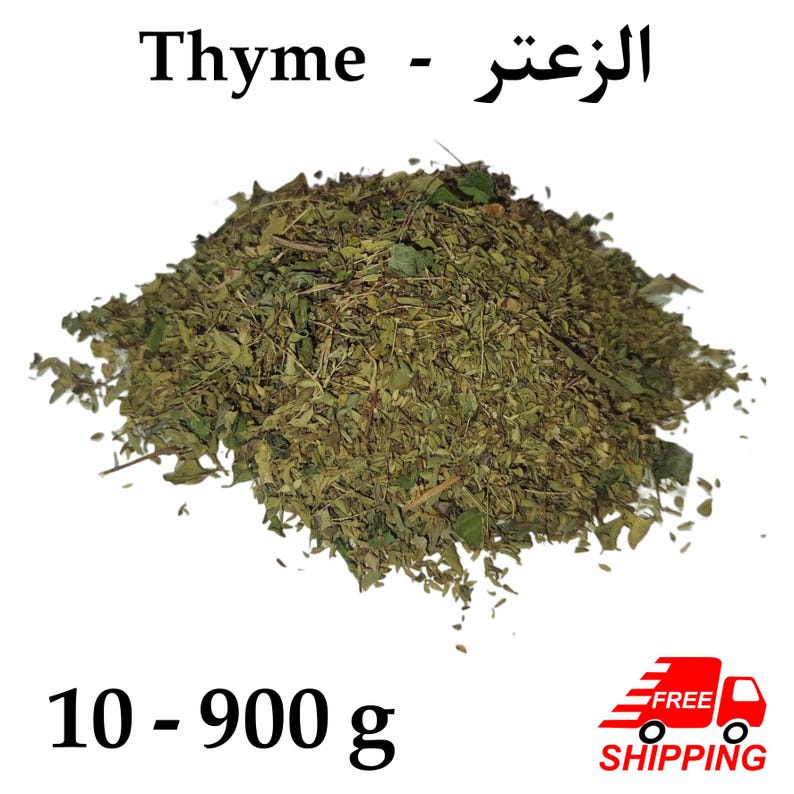 May include: A pile of dried thyme leaves, a culinary herb, is displayed against a white background. The text "Thyme - الزعتر" is at the top. The weight range is indicated as 10 - 900 g.
