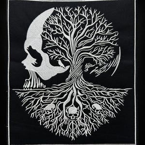 May include: Embroidered patch with a white skull and tree design on a black background. The tree's branches and roots are detailed, with small skulls at the roots. The patch has a white border. A gothic-themed patch.