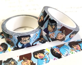 May include: Two rolls of washi tape featuring cartoon characters with blue, white, and black designs. The tape is on a white background.
