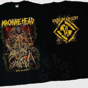 May include: Black t-shirt with the band name "MACHINE HEAD" in yellow, and a detailed graphic of a creature, plus the text "UNTO THE LOCUST". The back has a yellow design with the same text.