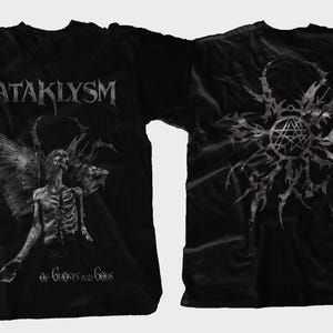 May include: Black t-shirt featuring the band name KATAKLYSM in silver lettering. The front graphic depicts a skeletal figure with wings and the text "Of Ghosts and Gods." The back displays a detailed, abstract design.
