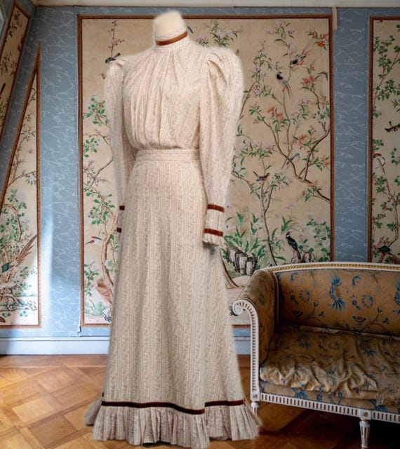 ensemble dress design Pleated Ombre Ensemble. Embodies effortless sophistication and optimism. Crafted from lightweight pleated fabric, the design features a wrap-style top with soft draping and a self-tie belt, paired with a flowing ombr skirt