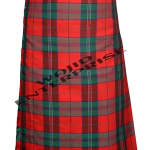 May include: A red, green, and brown plaid kilt. The kilt features a traditional tartan pattern with vertical and horizontal lines creating a checkered design. The kilt is made of a woven fabric and has a pleated construction.