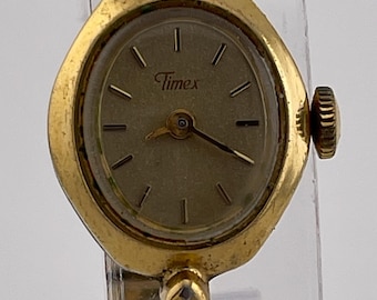 Timex: Woman’s vintage (70S) gold filled electric wrist watch with thin band. Timex Electric Ladies Watch 1974 With Gold Embossed Flower  main image 3