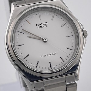 Casio MTP-1130 Quartz Men’s Watch – Silver-Tone Stainless Steel – White Dial – Japan Movement – Minimalist Classic 2000s