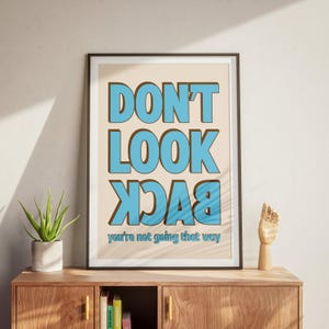 Don&#39;t Look Back, You&#39;re Not Going That Way - Motivational Wall Art