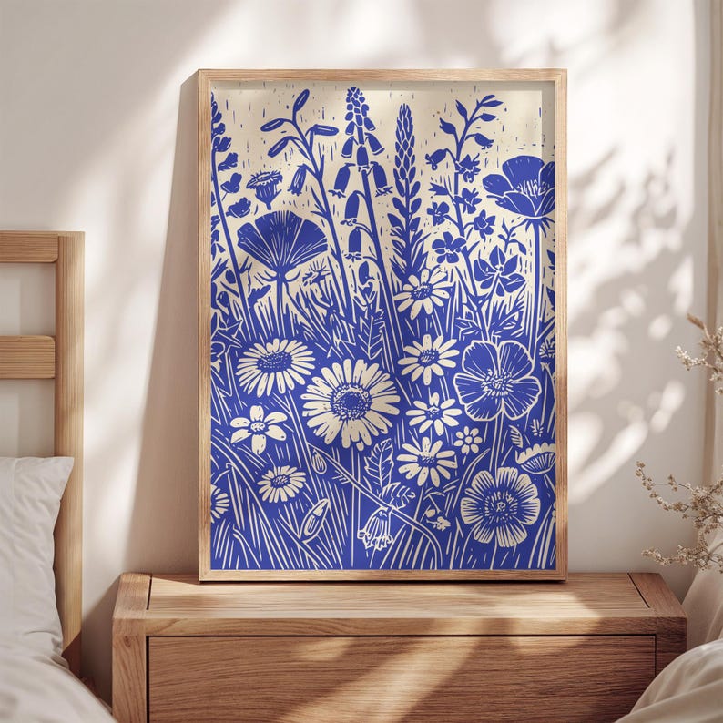 May include: A blue and white floral print with a variety of flowers and leaves. The print is in a wood frame.