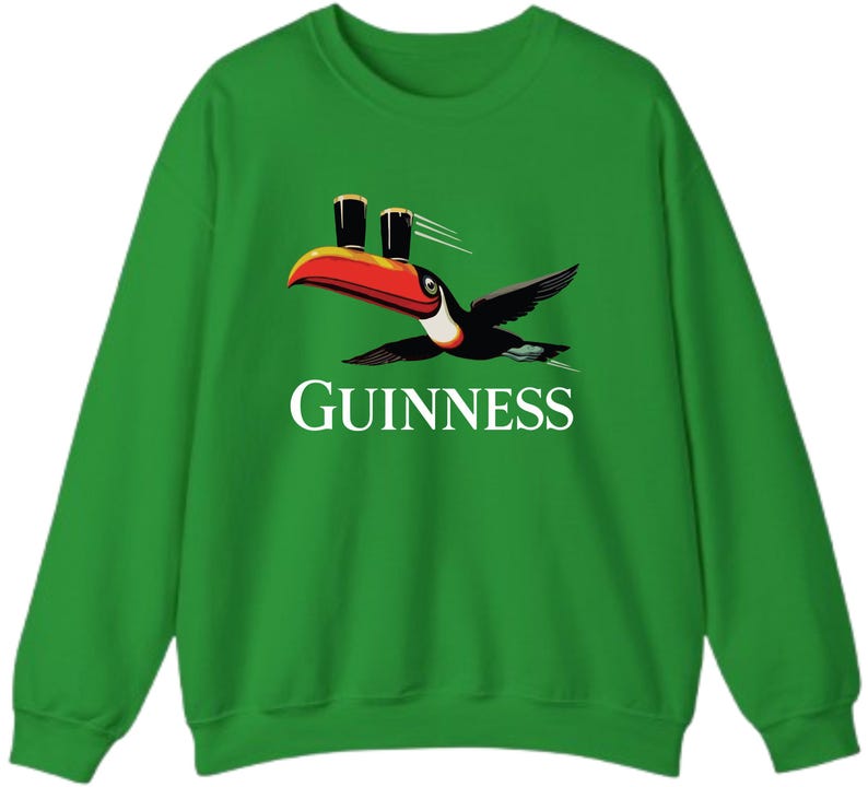 May include: Green sweatshirt featuring a toucan carrying two pints of Guinness. The toucan has a red and orange beak, black wings, and white accents. The word "GUINNESS" is printed in white below the toucan.