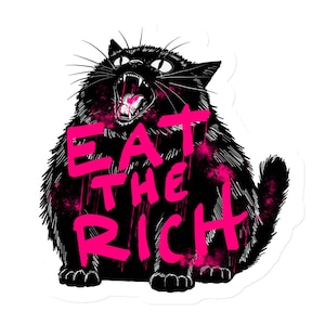 May include: A black cat with a wide open mouth and sharp teeth, with the words "EAT THE RICH" written in pink across its body.