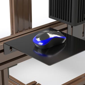 May include: A black computer mouse with a blue light on a black platform attached to a brown metal frame.