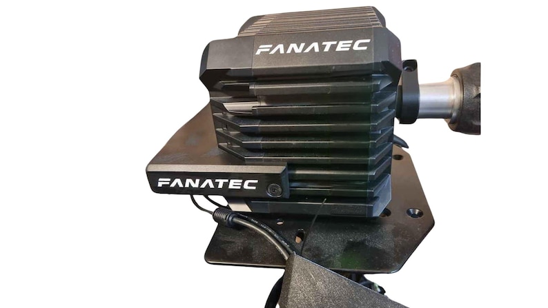 May include: A black Fanatec racing wheel base with a black metal base and a black cable. The wheel base has a silver metal connector and the text "FANATEC" printed on it.